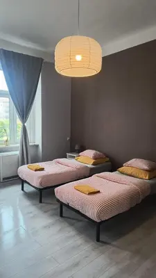 Łóżko lub łóżka w pokoju w obiekcie Colourful Rooms Wrocław