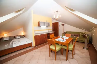 Łóżko lub łóżka w pokoju w obiekcie Apartamenty Dom na Wzgórzu Gardenia