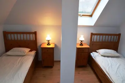 Łóżko lub łóżka w pokoju w obiekcie Apartamenty Dom na Wzgórzu Gardenia