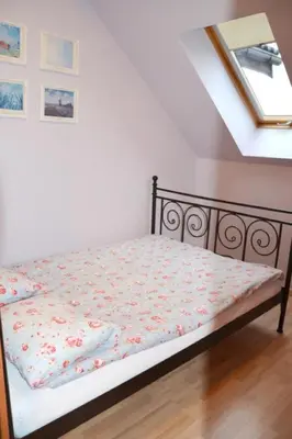 Łóżko lub łóżka w pokoju w obiekcie Apartamenty Dom na Wzgórzu Gardenia