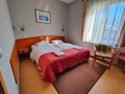 Łóżko lub łóżka w pokoju w obiekcie Delta In