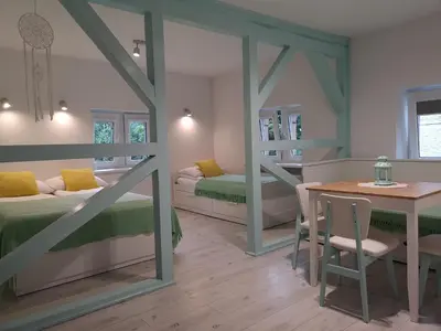 Łóżko lub łóżka w pokoju w obiekcie Kot Pocztowy