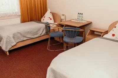 Łóżko lub łóżka w pokoju w obiekcie Motel Łasuch