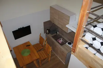 Telewizja i/lub zestaw kina domowego w obiekcie Apartamenty Górskie
