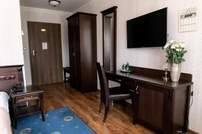 Telewizja i/lub zestaw kina domowego w obiekcie Oławian Hotel