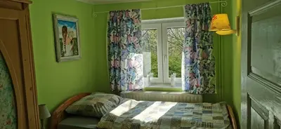 Łóżko lub łóżka w pokoju w obiekcie Wsiowa Chata