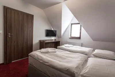 Łóżko lub łóżka w pokoju w obiekcie Noclegi Gawra