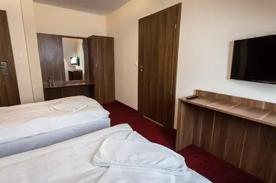 Łóżko lub łóżka w pokoju w obiekcie Noclegi Gawra