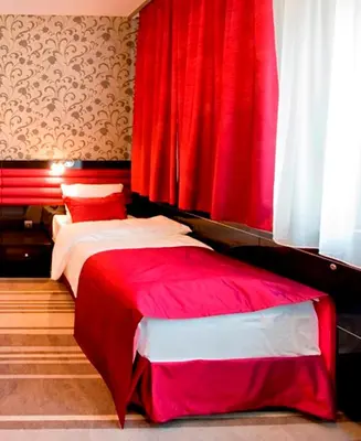 Łóżko lub łóżka w pokoju w obiekcie Hotel Symfonia Osjaków