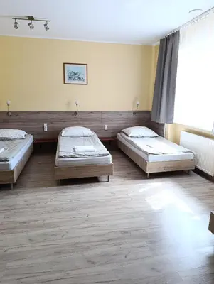 Łóżko lub łóżka w pokoju w obiekcie Noclegi 