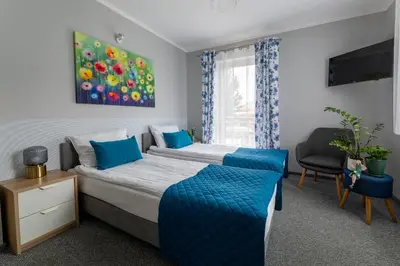 Łóżko lub łóżka w pokoju w obiekcie Apartamenty Wczasowa - z widokiem na góry, parkingiem, narciarnią