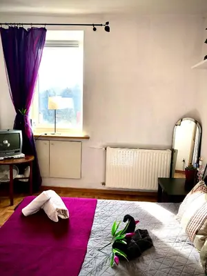 Łóżko lub łóżka w pokoju w obiekcie Mieszkanie w Srodmiesciu blisko rynku