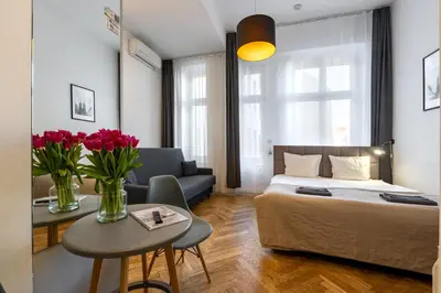 Łóżko lub łóżka w pokoju w obiekcie Wroclaw City Apartments