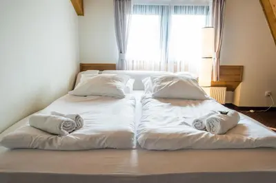 Łóżko lub łóżka w pokoju w obiekcie Zajazd Góra Św. Anny