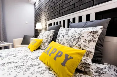 Łóżko lub łóżka w pokoju w obiekcie Grey Studio II