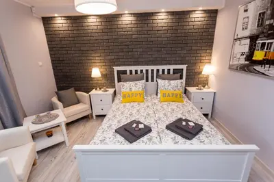 Łóżko lub łóżka w pokoju w obiekcie Grey Studio II