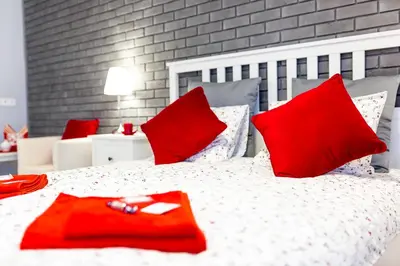 Łóżko lub łóżka w pokoju w obiekcie Grey Studio II