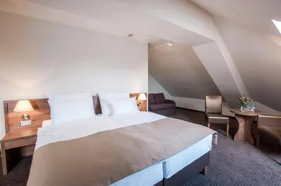 Łóżko lub łóżka w pokoju w obiekcie Hotel Gem