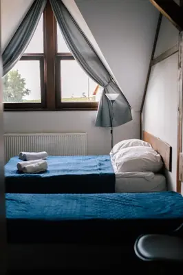Łóżko lub łóżka w pokoju w obiekcie Pod Sową