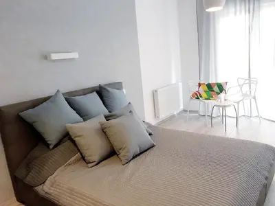 Łóżko lub łóżka w pokoju w obiekcie Icon Apartments Centrum 68