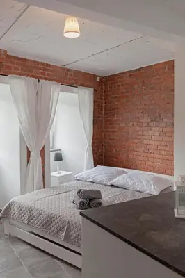 Łóżko lub łóżka w pokoju w obiekcie Apartament w starym browarze 2