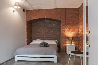 Łóżko lub łóżka w pokoju w obiekcie Apartament w starym browarze 2