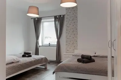 Łóżko lub łóżka w pokoju w obiekcie Apartamenty w Starym Browarze 3