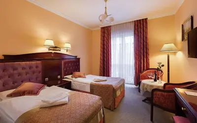 Łóżko lub łóżka w pokoju w obiekcie Hotel Adam & Spa
