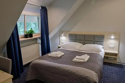 Łóżko lub łóżka w pokoju w obiekcie Hotel Podjadek