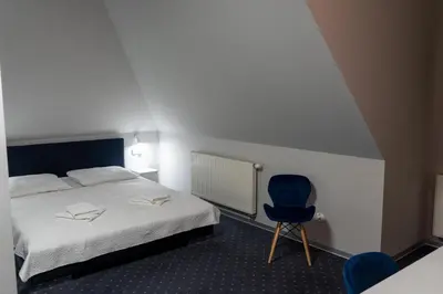 Łóżko lub łóżka w pokoju w obiekcie Hotel Podjadek