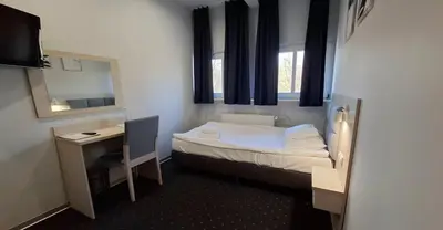 Łóżko lub łóżka w pokoju w obiekcie Hotel Podjadek