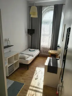 Łóżko lub łóżka w pokoju w obiekcie U Szermierzy