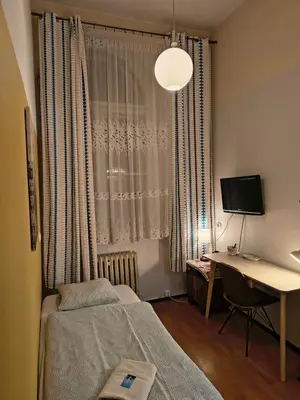 Łóżko lub łóżka w pokoju w obiekcie U Szermierzy