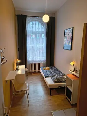 Łóżko lub łóżka w pokoju w obiekcie U Szermierzy