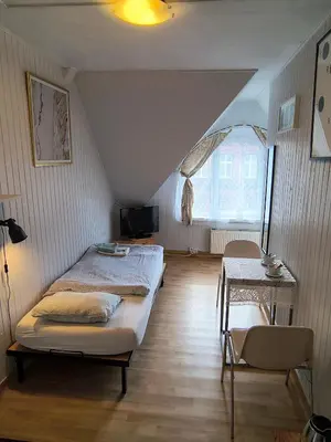 Łóżko lub łóżka w pokoju w obiekcie U Szermierzy