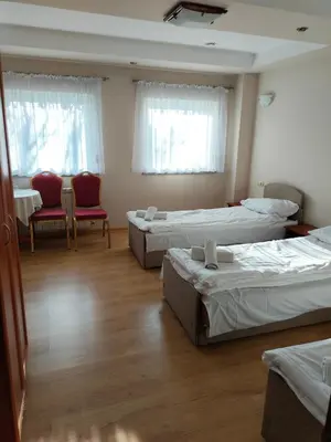Łóżko lub łóżka w pokoju w obiekcie Boho Hotel i Restauracja