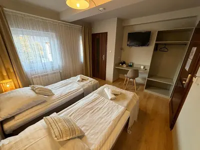 Łóżko lub łóżka w pokoju w obiekcie Boho Hotel i Restauracja