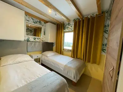 Łóżko lub łóżka w pokoju w obiekcie Apartament u Beti