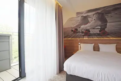 Łóżko lub łóżka w pokoju w obiekcie Active Hotel