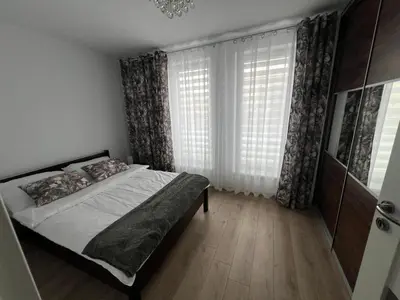 Łóżko lub łóżka w pokoju w obiekcie Apartament Zacisze