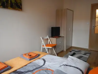 Łóżko lub łóżka w pokoju w obiekcie Traugutta apartment
