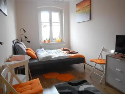 Łóżko lub łóżka w pokoju w obiekcie Traugutta apartment