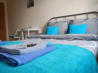 Łóżko lub łóżka w pokoju w obiekcie Traugutta apartment