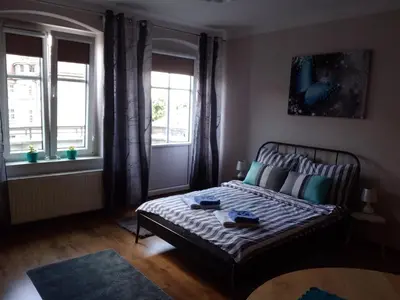 Łóżko lub łóżka w pokoju w obiekcie Traugutta apartment