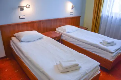 Łóżko lub łóżka w pokoju w obiekcie Hotel Neo