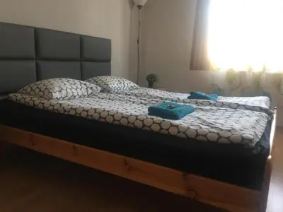 Łóżko lub łóżka w pokoju w obiekcie livingROOM_Wroc_Mosiężna