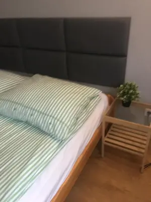Łóżko lub łóżka w pokoju w obiekcie livingROOM_Wroc_Mosiężna