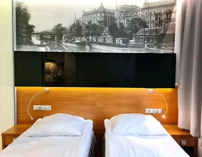 Łóżko lub łóżka w pokoju w obiekcie Hotel Malinowski Economy
