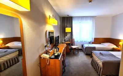 Łóżko lub łóżka w pokoju w obiekcie Hotel Malinowski Economy