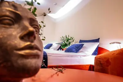 Łóżko lub łóżka w pokoju w obiekcie Hotel Royal